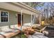 Attractive covered front porch with classic columns, updated fixtures, and a tidy walkway leading to the entry at 318 Holland Glen St, Fuquay Varina, NC 27526