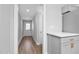 Hallway featuring new floors, fresh paint and easy access to the home's main entry at 318 Holland Glen St, Fuquay Varina, NC 27526