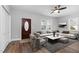 Bright living room features wood floors, modern furnishings, and a decorative fireplace, perfect for relaxation at 318 Holland Glen St, Fuquay Varina, NC 27526