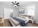 Main bedroom showcases natural light, new floors, fresh paint and updated en-suite bathroom at 318 Holland Glen St, Fuquay Varina, NC 27526