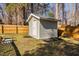 Backyard featuring a storage shed, providing additional storage solutions at 318 Holland Glen St, Fuquay Varina, NC 27526