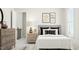 Serene bedroom with neutral decor, decorative wall art, and comfortable furnishings at 328 Canyon Spring Trl, Wake Forest, NC 27587