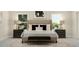 Luxurious bedroom featuring a padded headboard, side tables with lamps, and comfy bench at 328 Canyon Spring Trl, Wake Forest, NC 27587