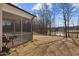 Spacious screened-in porch with a view of the landscaped backyard and pond at 40 Glendavis Hollow Dr, Franklinton, NC 27525