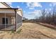 View of the spacious backyard and screened-in porch, perfect for outdoor entertaining and relaxation at 40 Glendavis Hollow Dr, Franklinton, NC 27525