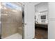 Modern bathroom featuring a walk-in shower, tile walls, and natural light at 40 Glendavis Hollow Dr, Franklinton, NC 27525
