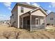 The backyard view showcases the home's screened-in porch and outdoor living space at 40 Glendavis Hollow Dr, Franklinton, NC 27525