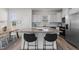 Kitchen island featuring granite countertops, bar seating, and white cabinets at 40 Glendavis Hollow Dr, Franklinton, NC 27525