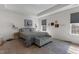 Spacious main bedroom featuring a tray ceiling, carpet, a sitting bench, and lots of natural light at 40 Glendavis Hollow Dr, Franklinton, NC 27525