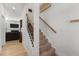 Carpeted staircase with decorative iron railing, leading to the upper level of the home at 40 Glendavis Hollow Dr, Franklinton, NC 27525