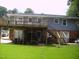 The backyard features a two-story deck and ample greenspace at 4408 Leota Dr, Raleigh, NC 27603