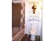 Bathroom with a bathtub, shower, and a white toilet at 4408 Leota Dr, Raleigh, NC 27603
