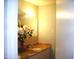 Bathroom featuring a large mirror, granite countertops, and tiled accents at 4408 Leota Dr, Raleigh, NC 27603