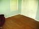 Bright bedroom with hardwood floors and a large closet at 4408 Leota Dr, Raleigh, NC 27603