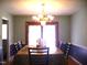 Bright dining room featuring chandelier and large window with natural light at 4408 Leota Dr, Raleigh, NC 27603
