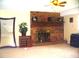 Living room with a brick fireplace and a large mirror at 4408 Leota Dr, Raleigh, NC 27603