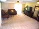 Spacious living room with comfortable seating, a TV, and a decorative mirror at 4408 Leota Dr, Raleigh, NC 27603