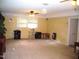 Large living room featuring a cat tree and a door at 4408 Leota Dr, Raleigh, NC 27603