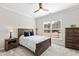 Bedroom featuring a wooden bed frame, window, and ceiling fan at 4809 Okeechobee Ct, Fuquay Varina, NC 27526