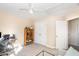 Spacious bedroom featuring a wooden display shelf, a work area, and ample closet space at 4828 Morning Edge Dr, Raleigh, NC 27613