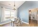 Bright dining area with a modern chandelier, a window, and stylish decor at 4828 Morning Edge Dr, Raleigh, NC 27613