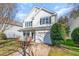 Charming two-story home with a front porch, a well-manicured lawn, and an attached garage at 4828 Morning Edge Dr, Raleigh, NC 27613