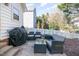 Back patio featuring a grill and comfortable seating, perfect for outdoor entertaining and relaxation at 4828 Morning Edge Dr, Raleigh, NC 27613