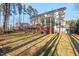 Two-story home featuring an expansive deck, screened porch, and well-maintained lawn at 504 Crooked Pine Dr, Cary, NC 27519