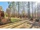 A spacious grassy backyard with scattered trees, offering plenty of room for outdoor activities at 504 Crooked Pine Dr, Cary, NC 27519