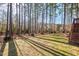Grassy backyard features mature trees and shrubs and lots of room for activities at 504 Crooked Pine Dr, Cary, NC 27519