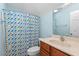 Bright bathroom with patterned shower curtain and a light wood vanity at 504 Crooked Pine Dr, Cary, NC 27519