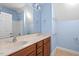 Bathroom showcasing double sinks, a large mirror, and blue walls at 504 Crooked Pine Dr, Cary, NC 27519