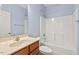 Well-lit bathroom features a tub and shower combination and vanity with a sink at 504 Crooked Pine Dr, Cary, NC 27519