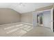 Large bedroom featuring neutral walls, carpet, and natural light at 504 Crooked Pine Dr, Cary, NC 27519