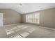 Bedroom with neutral walls, carpet, and natural light at 504 Crooked Pine Dr, Cary, NC 27519