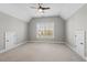 Bedroom featuring neutral walls, plush carpet, and architectural details at 504 Crooked Pine Dr, Cary, NC 27519