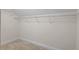 Walk-in closet featuring wire shelving and neutral walls at 504 Crooked Pine Dr, Cary, NC 27519
