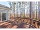 Home's deck overlooking a lush, wooded backyard for outdoor relaxation at 504 Crooked Pine Dr, Cary, NC 27519