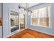 Dining room with sliding glass doors to the screened in porch at 504 Crooked Pine Dr, Cary, NC 27519