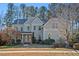 Charming two-story home featuring light blue siding, a covered front porch, and well-manicured landscaping at 504 Crooked Pine Dr, Cary, NC 27519