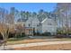 Charming two-story home with beautiful landscaping, neutral siding, and a welcoming entrance at 504 Crooked Pine Dr, Cary, NC 27519