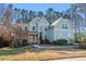 Charming two-story home with beautiful landscaping, neutral siding, and a welcoming entrance at 504 Crooked Pine Dr, Cary, NC 27519