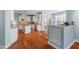 Well-lit kitchen with white cabinetry, stainless steel appliances, and a center island at 504 Crooked Pine Dr, Cary, NC 27519