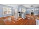 Bright living area with a fireplace, bar with mini-fridge, and sliding glass door to the exterior at 504 Crooked Pine Dr, Cary, NC 27519