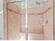 Modern tiled shower with glass doors and built-in bench at 504 Crooked Pine Dr, Cary, NC 27519