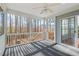 Cozy screened-in sunroom with ceiling fan and backyard access at 504 Crooked Pine Dr, Cary, NC 27519