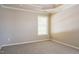 Bedroom with tray ceiling and large window with natural light shining through at 5129 Chasteal Trl, Raleigh, NC 27610
