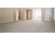 Spacious, well-lit bedroom with neutral carpet, multiple closets, and natural light at 5129 Chasteal Trl, Raleigh, NC 27610
