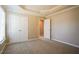Bedroom with closet and door to another room, with neutral colors and carpet at 5129 Chasteal Trl, Raleigh, NC 27610