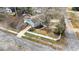 Aerial view of this home on a corner lot, green yard, mature trees, and fenced backyard at 5412 Farley Dr, Raleigh, NC 27609